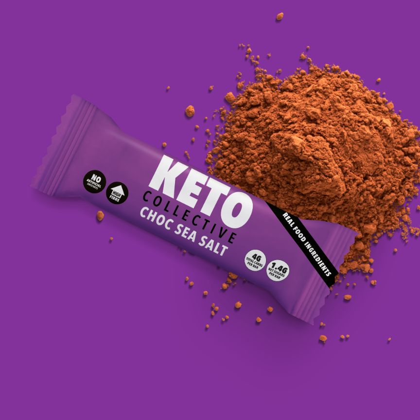 choc sea salt keto bar and cocoa purple background